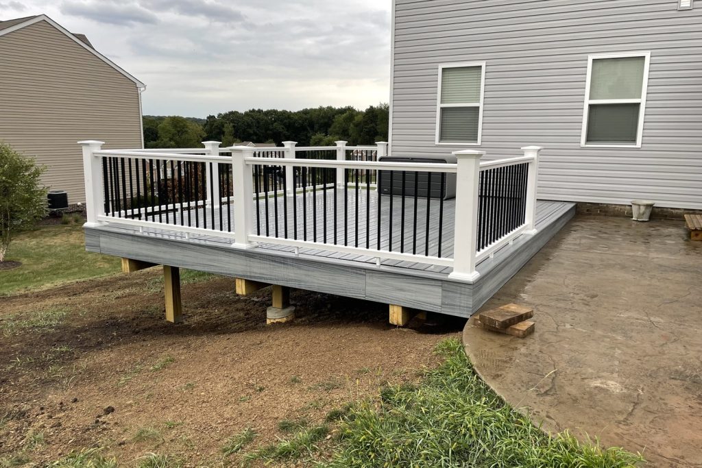Deck railing and steps on a residential deck built by Daily Landscaping in Monaca, PA