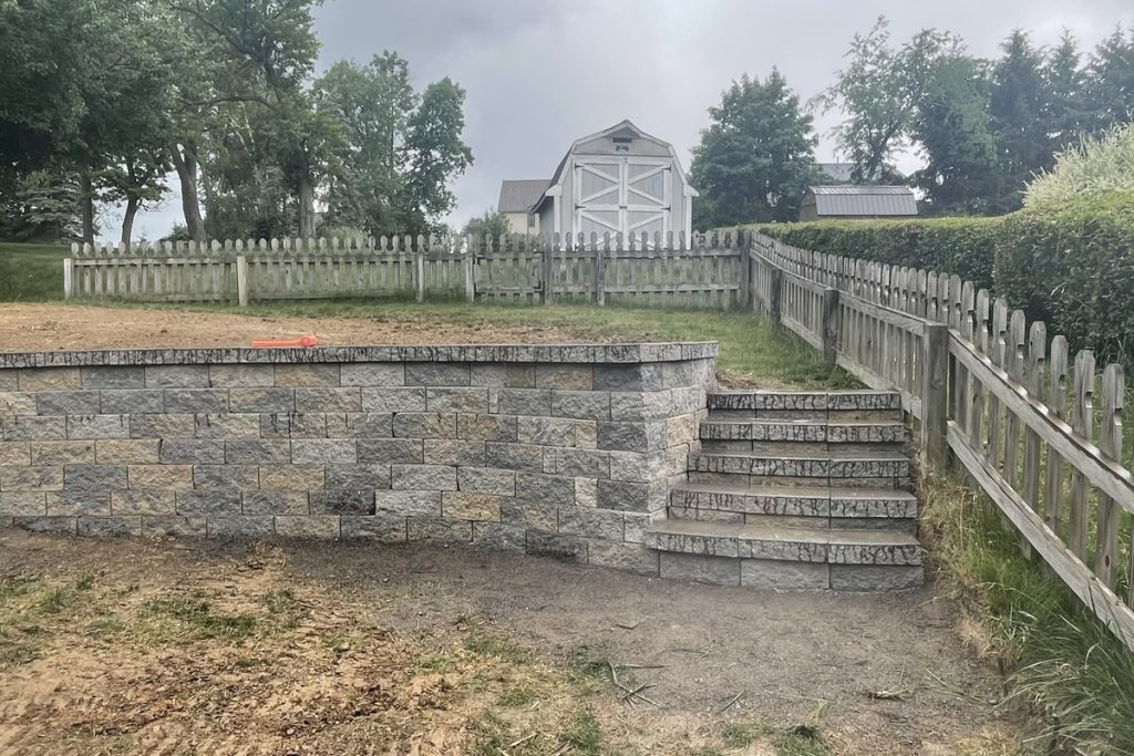 Excavation and grading work on a sloped site by Daily Landscaping in Western Pennsylvania