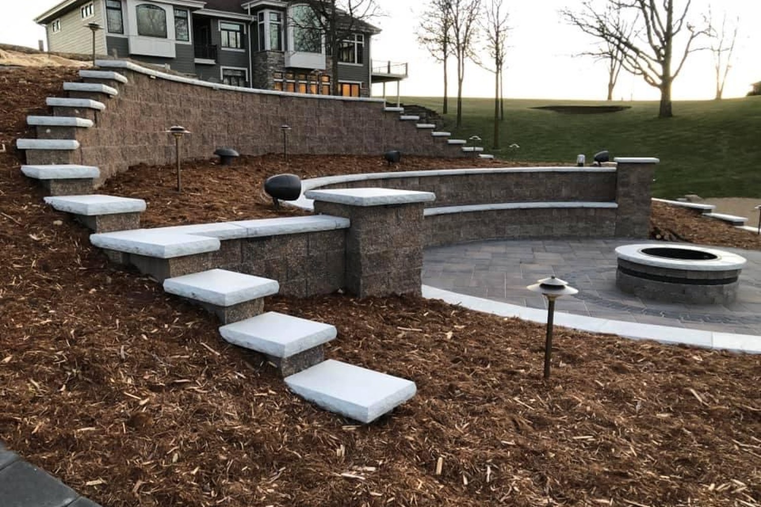 Tiered retaining wall with planted beds, built by Daily Landscaping in Western Pennsylvania