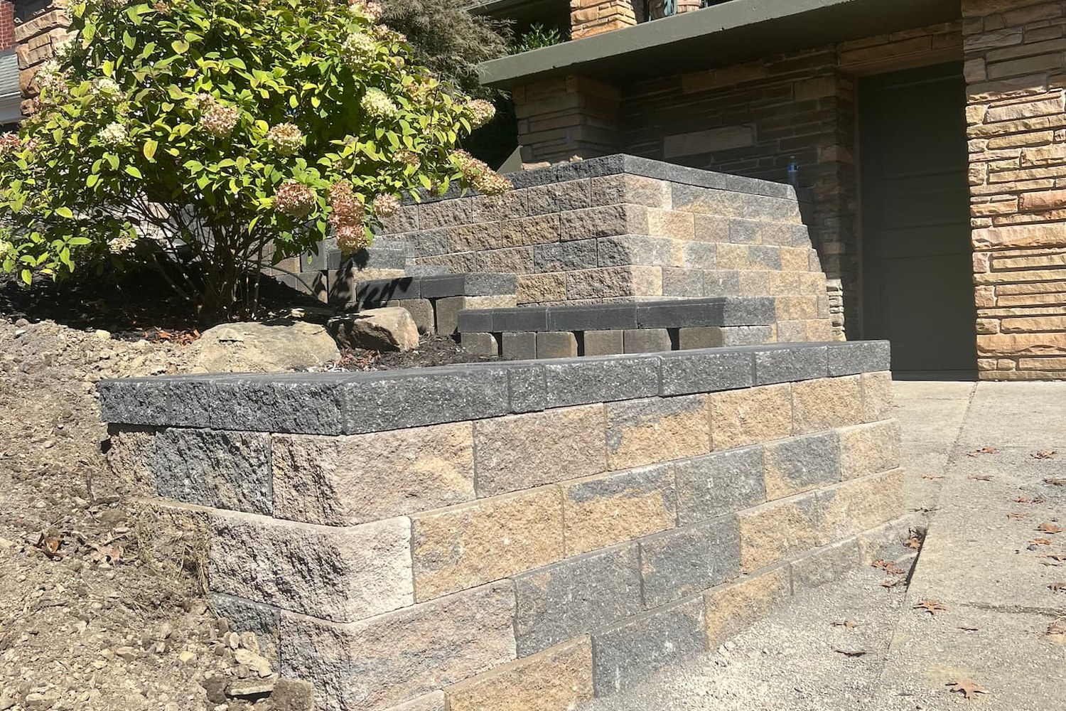 Versa-Lok segmental retaining walls and steps installed by Daily Landscaping in Sewickley, PA