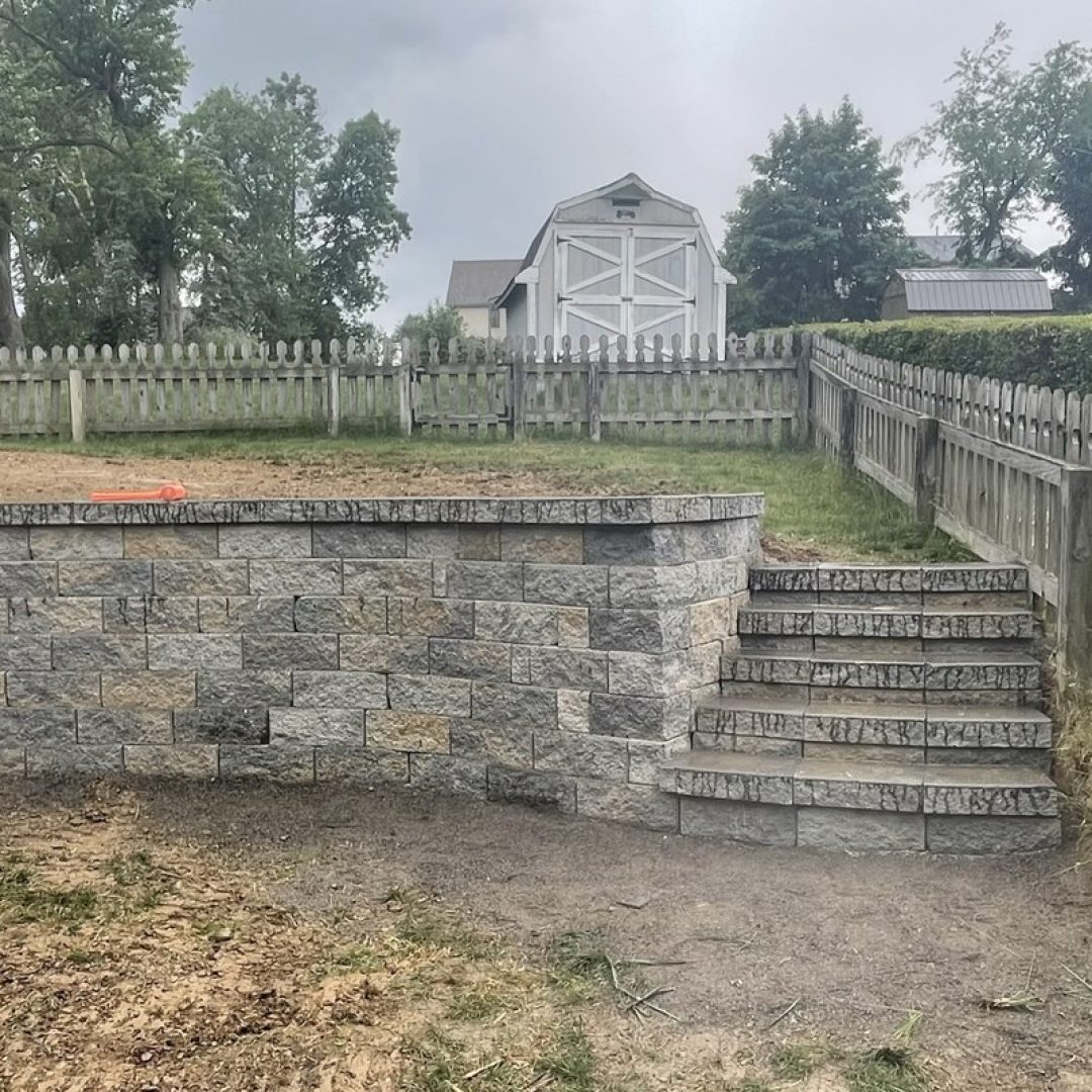 Excavation and grading work on a sloped site by Daily Landscaping in Western Pennsylvania